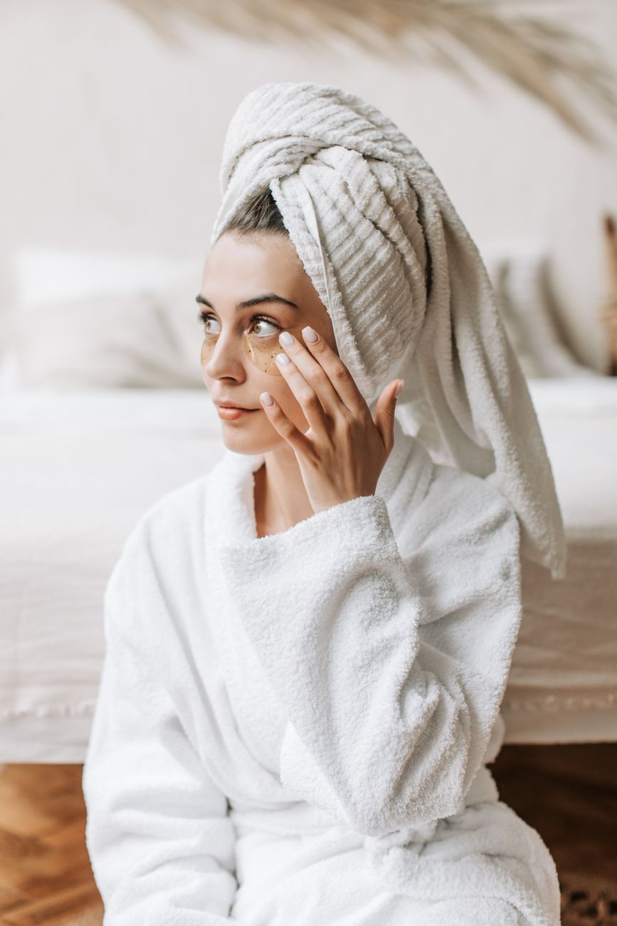 A woman enjoying a relaxing skincare moment at home